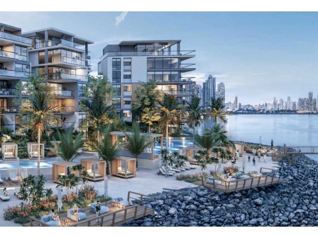 Modern apartment buildings with balconies, pools and lush landscaping at Ocean Reef