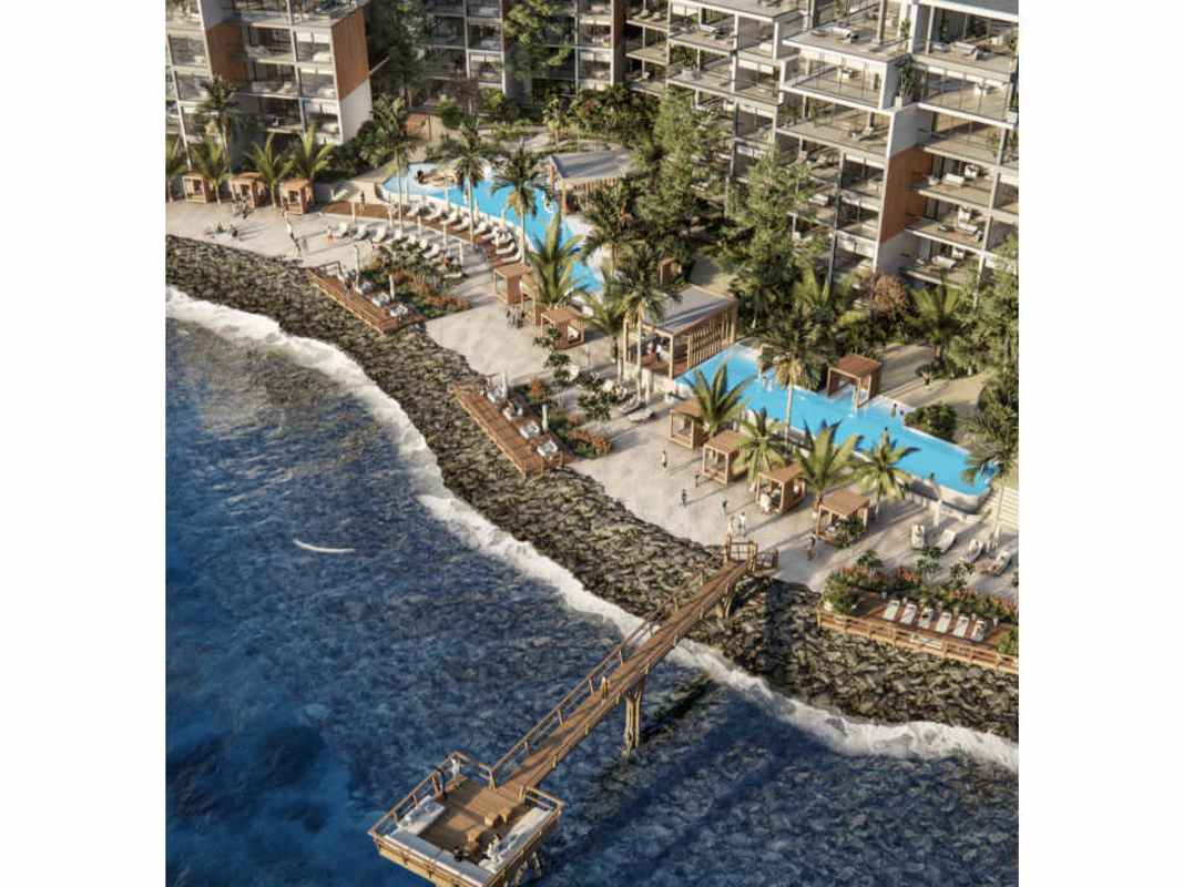 Aerial plan showcasing multiple pools, beach cabanas and beachfront buildings Ocean Reef Panama