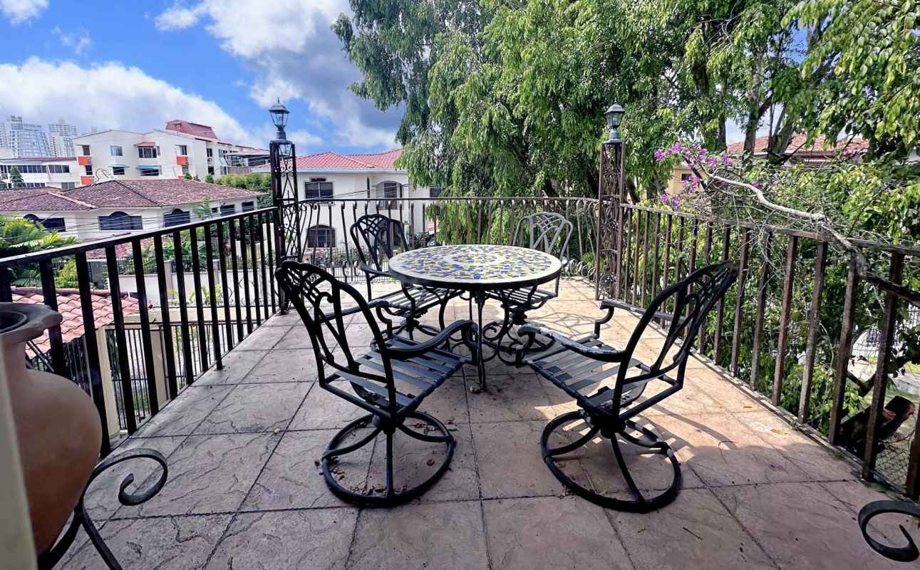 Balcony wrought iron mosaic table city views La Alameda Panama