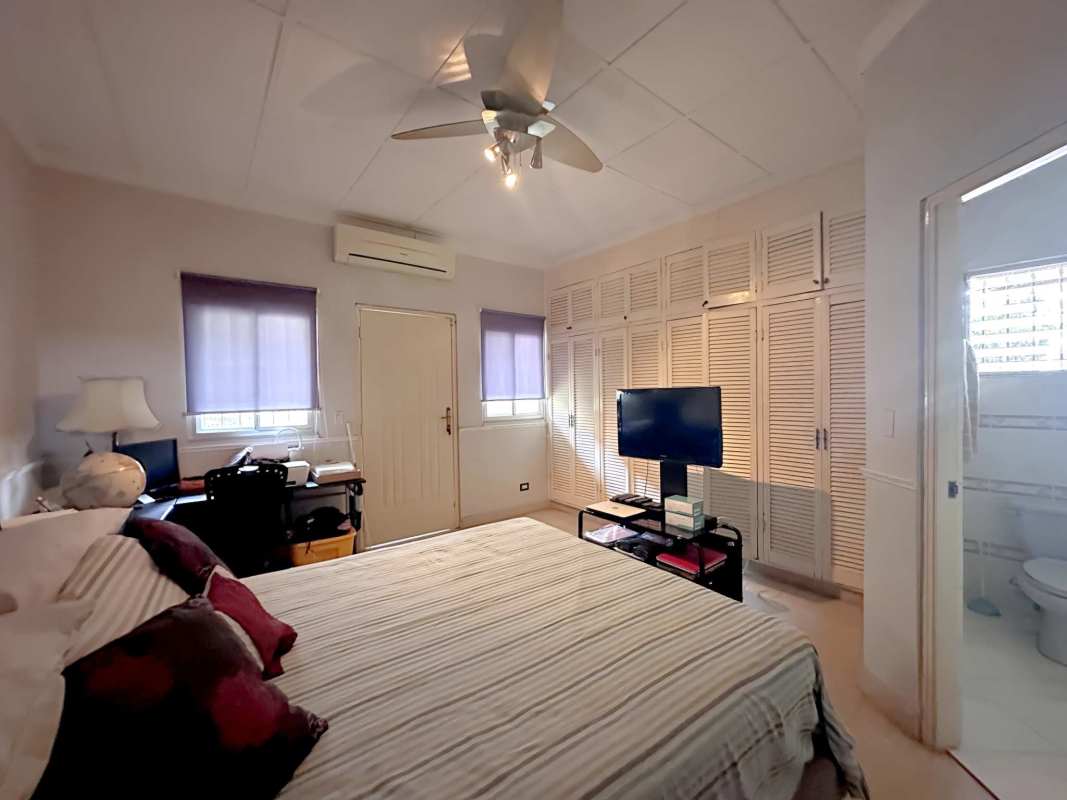 Bedroom with desk built-in closets ensuite bathroom La Alameda Panama