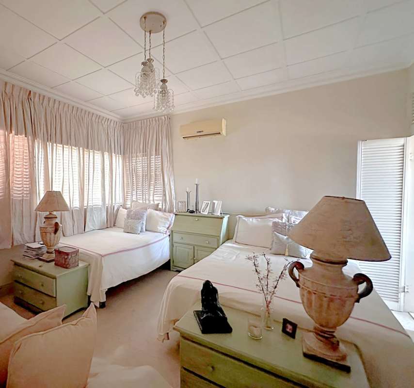 Bathroom with storage cabinets shower window La Alameda Panama