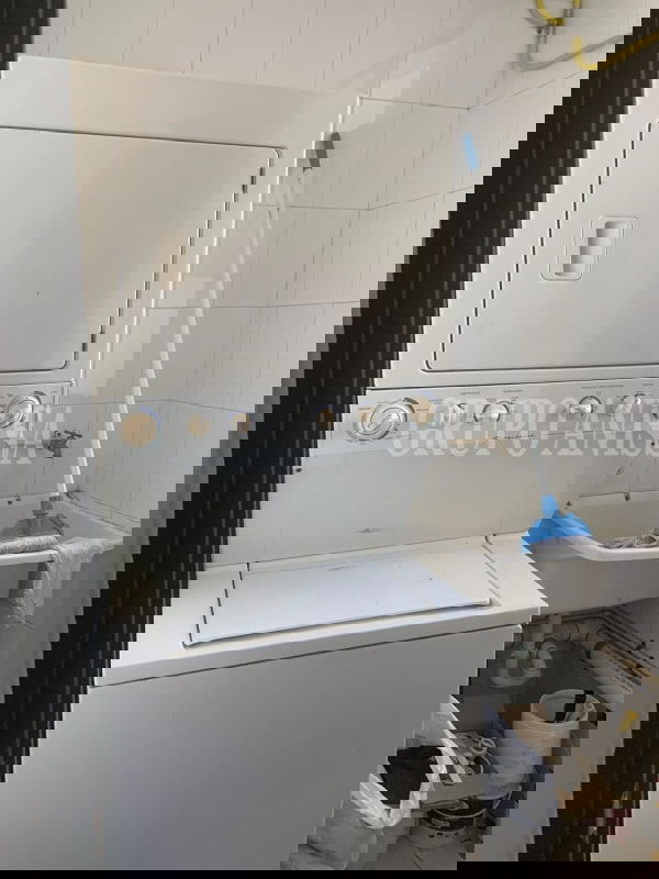 Bedroom with city skyline and ocean views, large window and wardrobes at PH Dos Mares Panama City