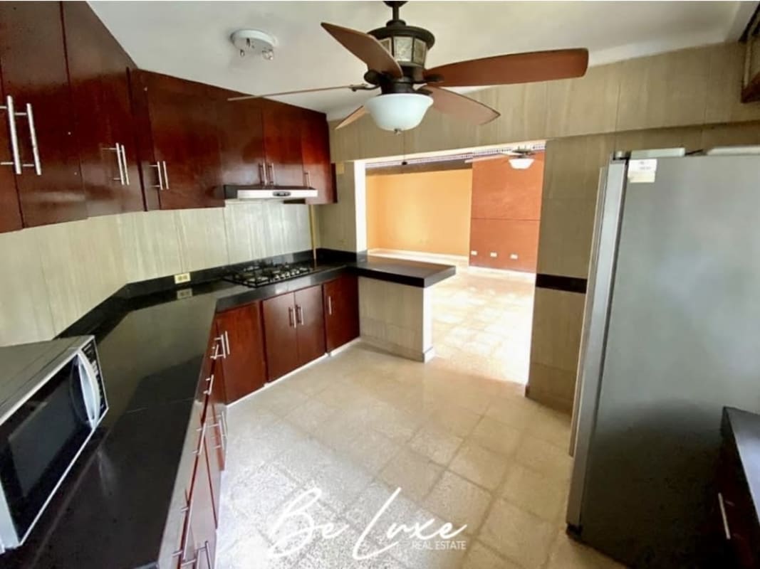 Modern renovated kitchen with granite countertops and wood cabinetry PH Las Perlas Punta Paitilla Panama