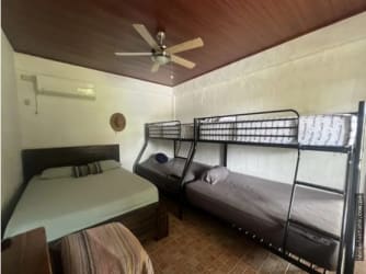 Country ranch style home with swimming pool, patio, garden and tropical landscaping in Playa Gorgona Panama