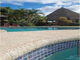 Bedroom with queen and bunk beds, ceiling fan, split AC at Playa Gorgona Panama