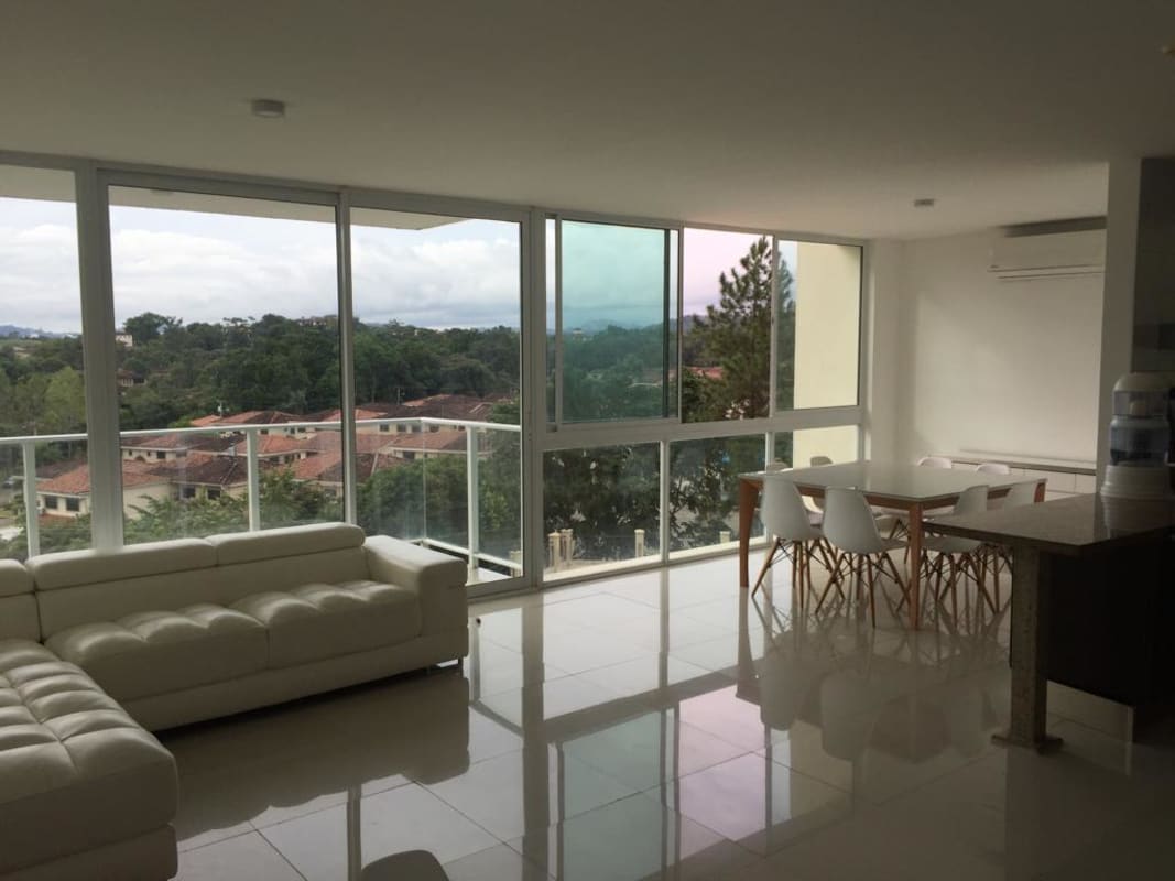 Outdoor swimming pool and Jacuzzi surrounded by gardens and sun loungers in PH Pine Hills Albrook Panama