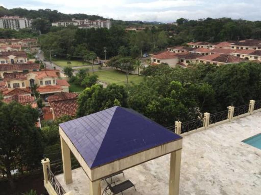Stylish kitchen with granite countertops, island, and appliances at PH Pine Hills Albrook Panama City