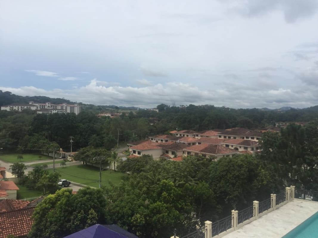 Main bedroom with big windows, green leafy views, AC and ample closet space at PH Pine Hills Albrook Panama