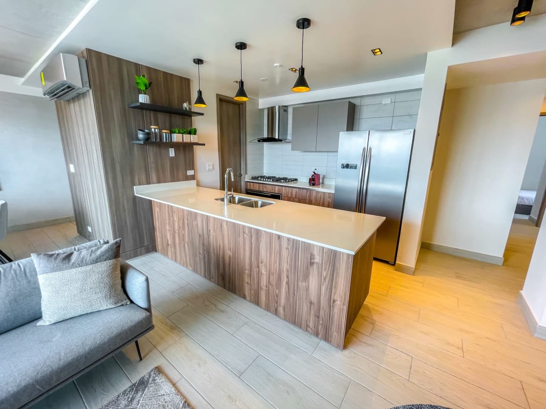 Open concept kitchen island, quartz countertops, smart condo Panama City PH La Loma