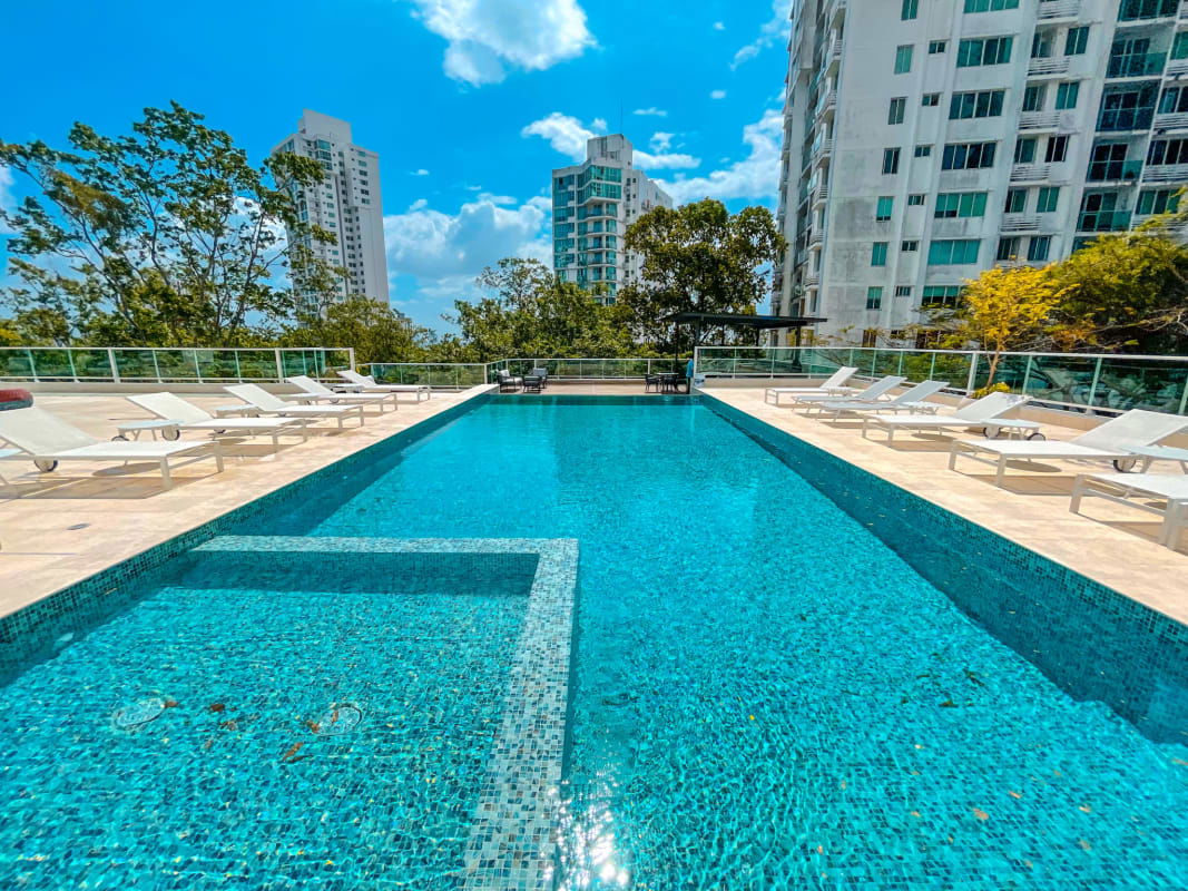 Outdoor pool and jacuzzi with city skyline, luxury amenities PH La Loma Panama City