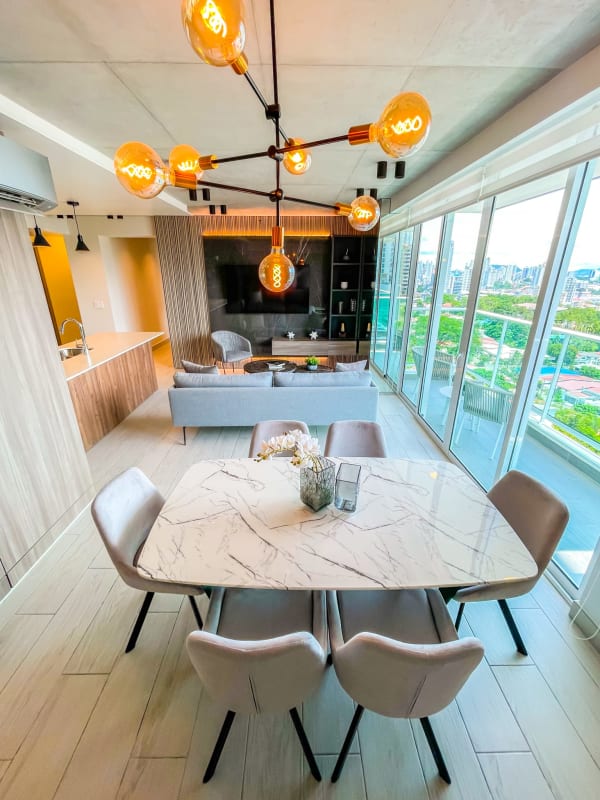 Modern kitchen featuring island, quartz countertops, and stainless steel appliances in PH Altamira Residences