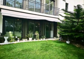 Bedroom with tropical garden views and large window in Buenaventura vacation apartment Panama