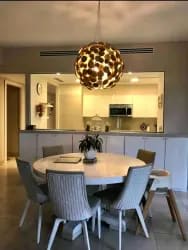 Private garden terrace with patio furniture at Buenaventura Beach & Golf Resort condo Panama