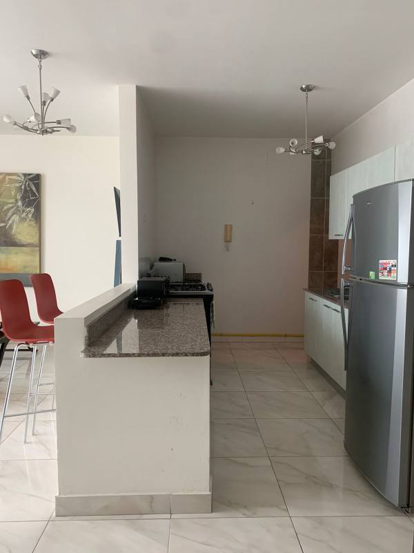 Open living and dining area with large windows PH Cosmopolitan Panama City