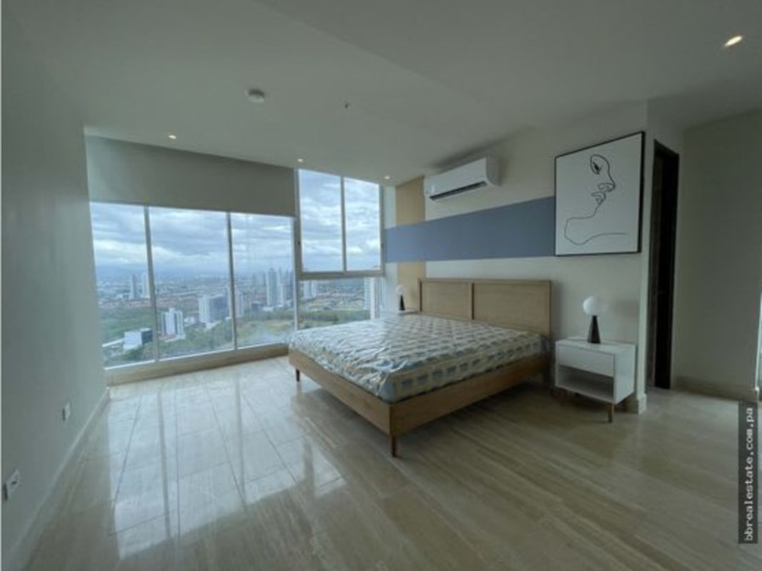 Bright master bedroom fully furnished with panoramic windows Costa del Este Panama rental