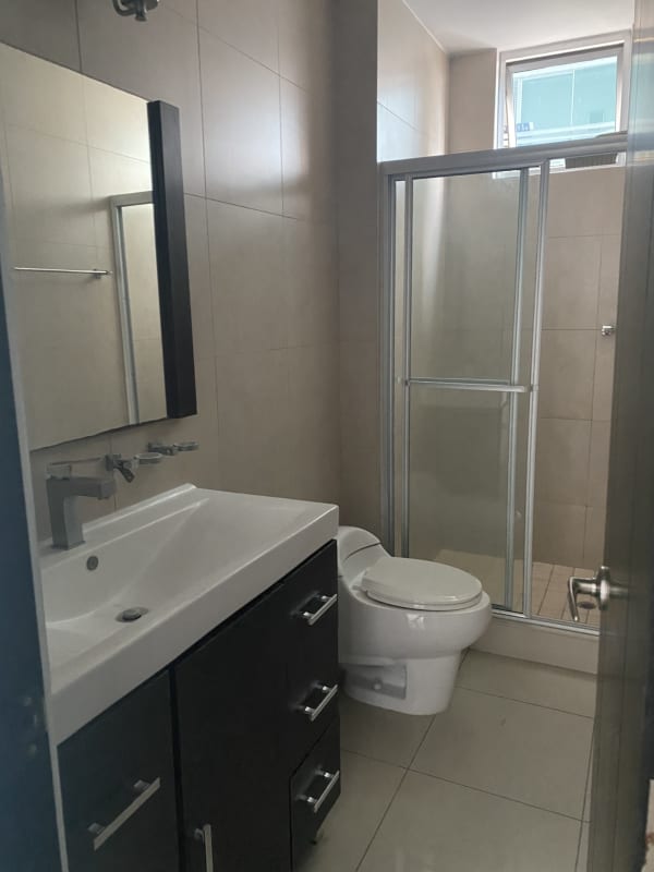 Modern gym with cardio equipment and city views at PH Costa Pacifica San Francisco Panama