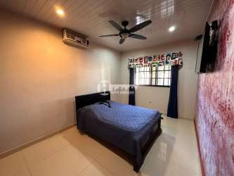 Bedroom with textured wall, AC, ceiling fan, ceramic tile, and mounted TV in family house La Villa de Los Santos