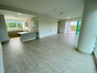 Large terrace with lush garden and partial ocean views at PH Solea Punta Barco Panama