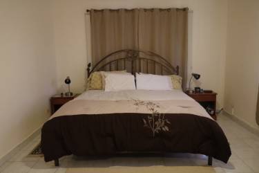 Custom rustic wine cellar with barrel decor seating mural Altos de la Paz Estate Chame Panama