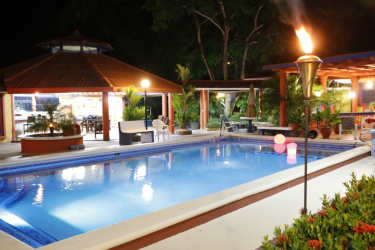 Cozy bedroom floral bedding tile flooring window security bars Chame Panama estate