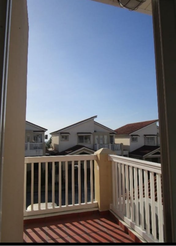 Modern kitchen with granite countertops and appliances in Brisas del Golf house Panama