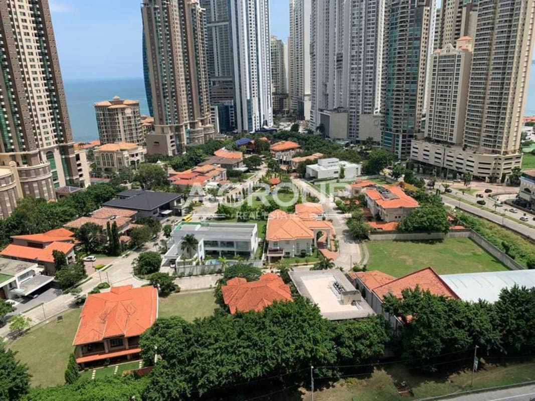 Aerial panorama of residential lots, ocean views, high-rises and greenery at Gold Point Punta Pacífica Panama