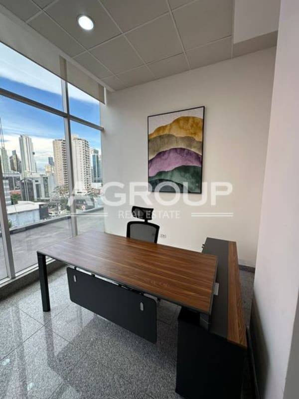 Office with large windows city skyline view wood desk PH Habitats Plaza Obarrio Panama