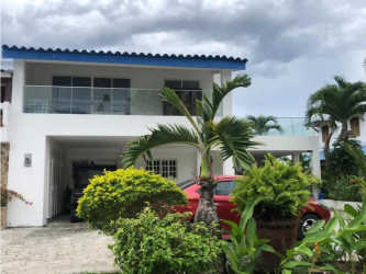 Contemporary villa with multiple terraces, private swimming pool and tropical landscaping at waterfront in Panama