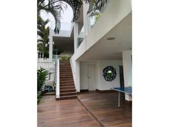 Two-story tropical home with balcony, lush gardens and beach view in Playa Blanca Marina Del Rey Panama