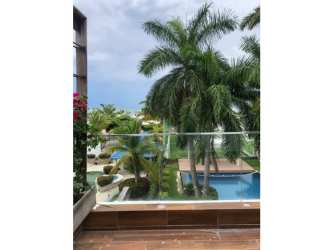 Oceanfront pool terrace with sun deck, palm trees and panoramic playa view Playa Blanca Panama