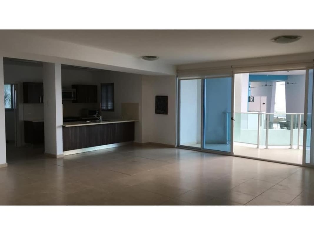 Large open living room with balcony access and ocean view in Punta Pacifica condo