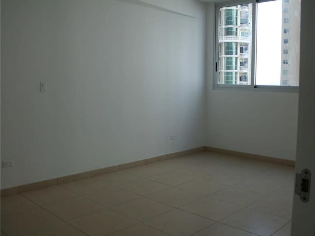 Master bedroom with large window and Pacific Ocean view in Punta Pacifica condo