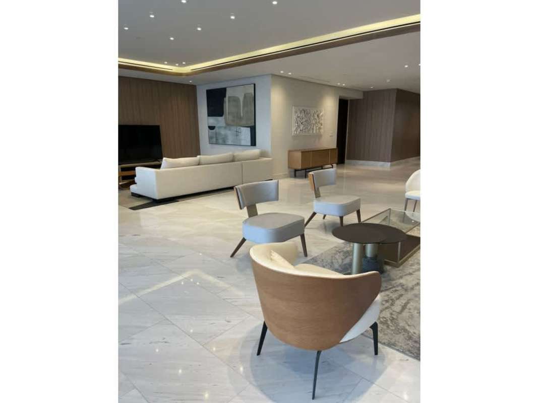 Formal dining room with panoramic skyline views at The Towers Punta Paitilla luxury condo