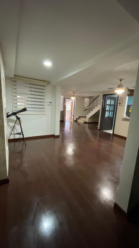 Laundry space tiled with utility sink water heater and window in Condado del Rey house