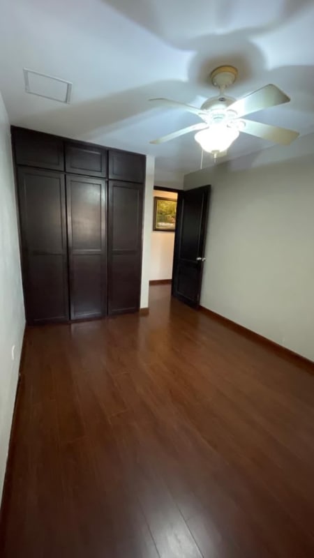 Modern bathroom with tiled walk-in shower double vanity sinks and large mirror Condado del Rey Panama