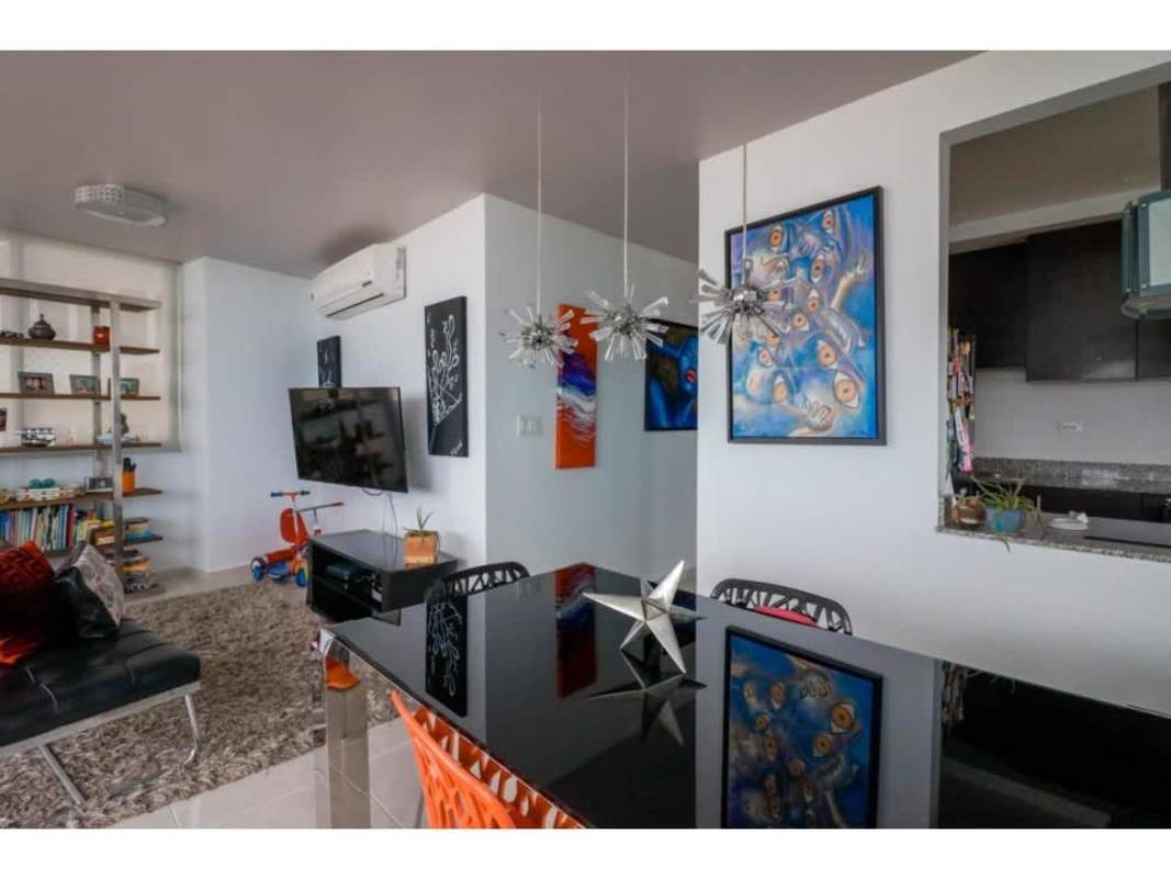 Modern kitchen featuring granite countertops, premium appliances, white tile backsplash in PH Bay View Avenida Balboa Panama City