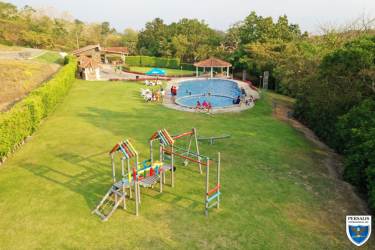 Aerial with pool, playground, gazebos at Valle Village gated community Panama