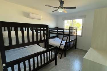 Bedroom with large window garden view ceiling fan Punta Barco Panama house for sale