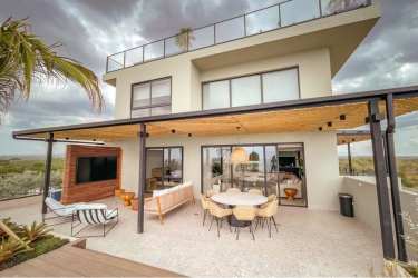 Modern kitchen equipped stainless appliances in beachfront penthouse at Punta Caelo