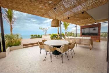 Master bedroom with floor-to-ceiling ocean view windows Punta Caelo San Carlos Panama