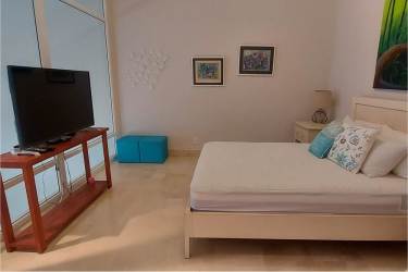 Spacious bedroom with large windows, park views in Buenaventura beach villa Panama