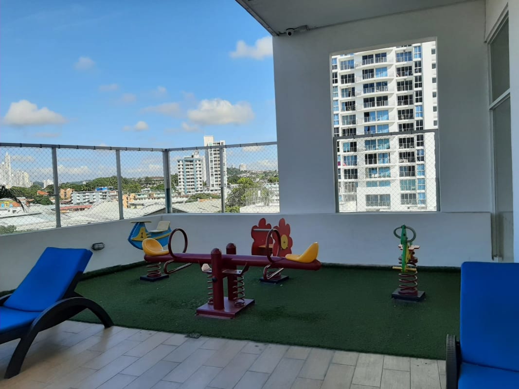 High-rise terrace children's playground area with city skyline views PH Parque Lefevre Panama