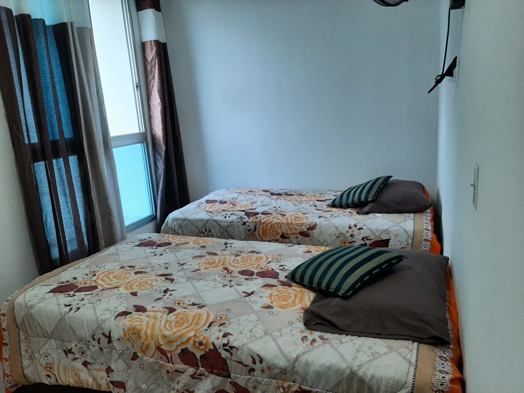 Bedroom with twin beds and window PH Parque Lefevre Panama Panama City