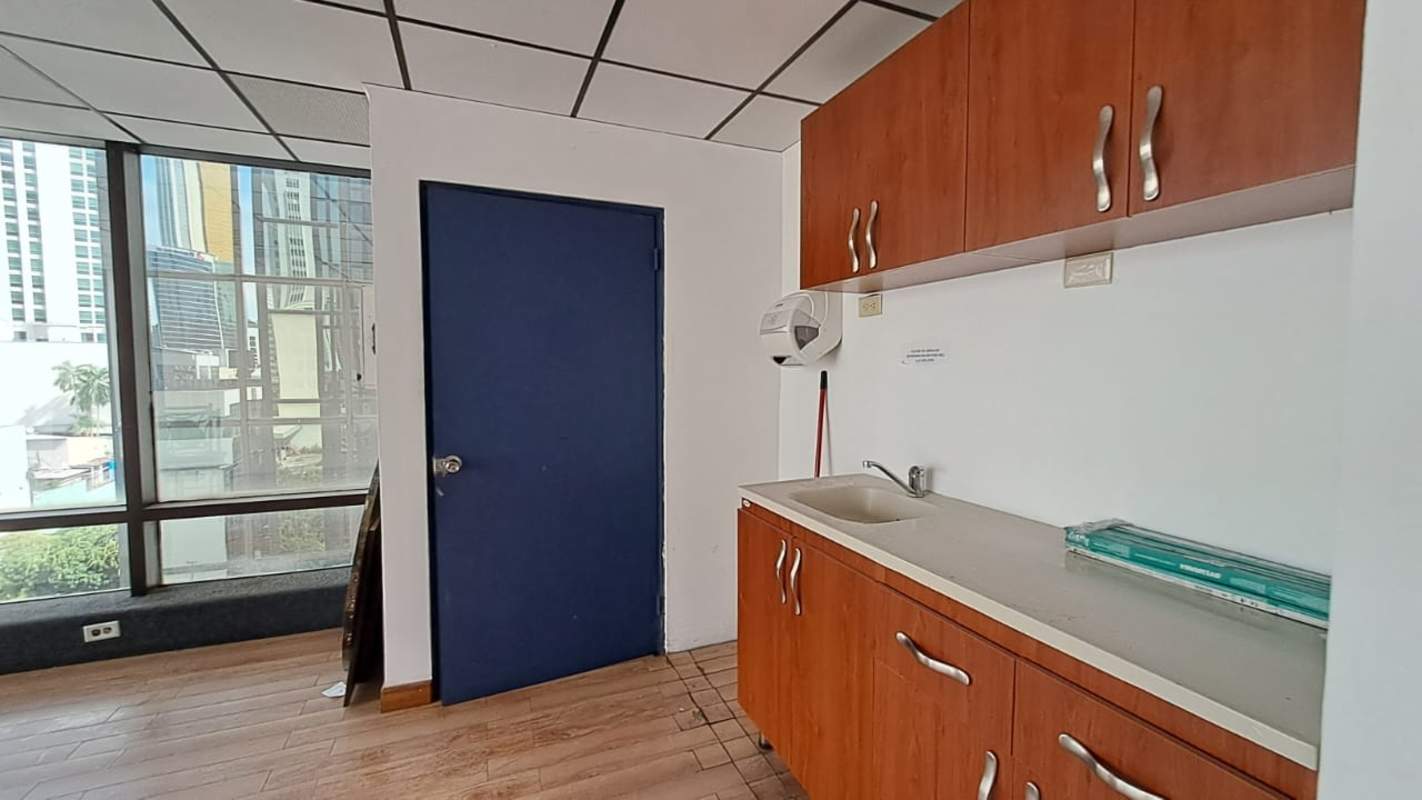 Office kitchenette with cabinets window with city view Edificio Vallarino Obarrio Panama