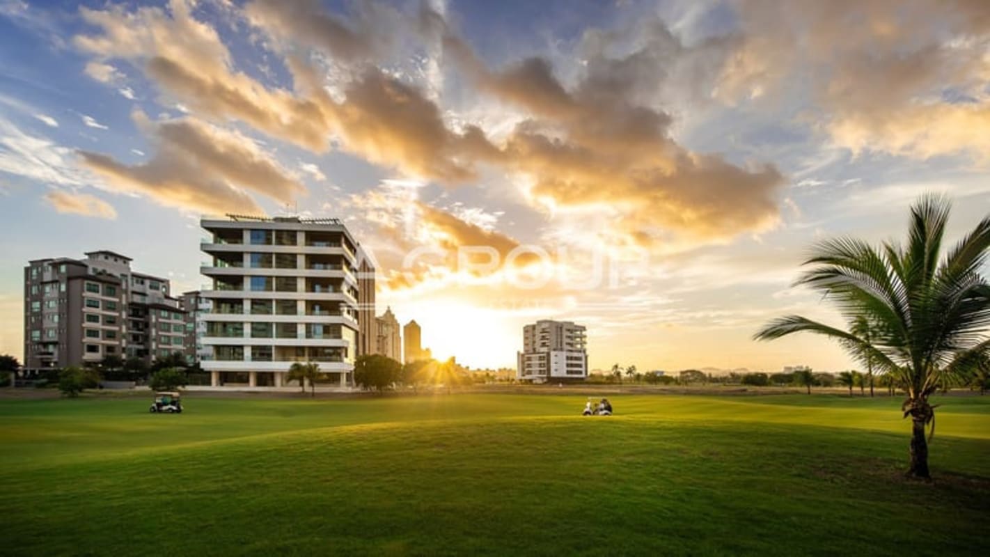 Golf course with sunset backdrop and luxury residences at Santa Maria Panama