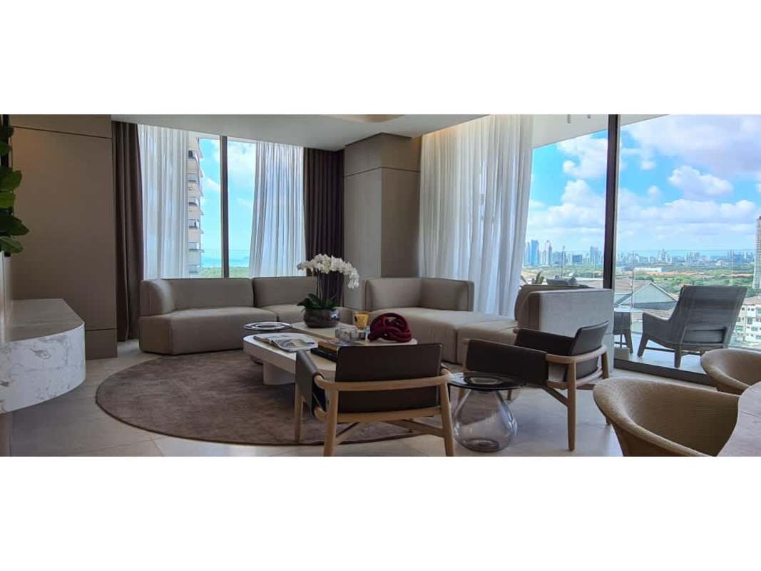Spacious modern living room with floor-to-ceiling windows and skyline view in La Maison at Santa María Panama