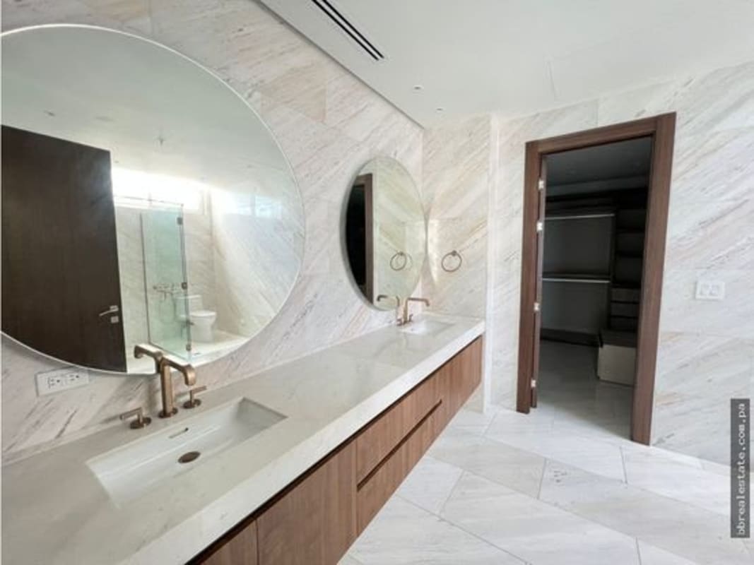 Fully equipped gym with boxing ring, mirrors, and training equipment in PH The Towers