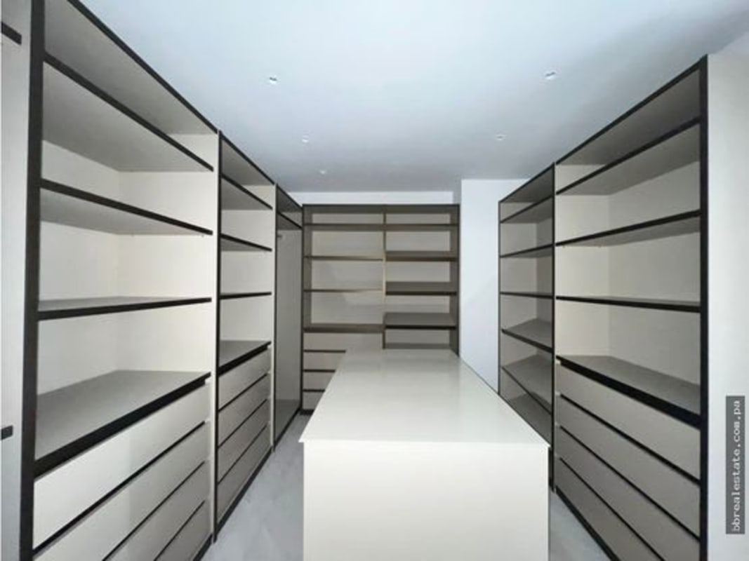 Elegant master bedroom with panoramic floor-to-ceiling ocean view windows at PH The Towers Punta Paitilla