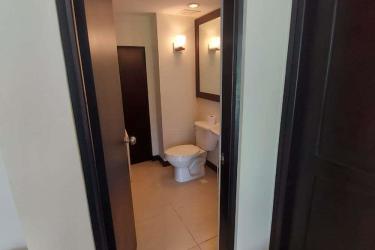 Master bedroom with sliding door to balcony overlooking green golf lawns Decameron Golf Villas Panama