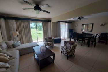 Wide living dining open plan with access to terrace overlooking garden golf Decameron Panama